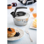 Chaleira Tramontina 1,5L Fundo Triplo e Cabo Preto Inox